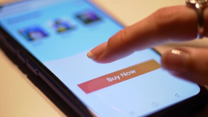Close-up of a Finger Tapping "Buy Now" Button on a Smartphone Screen, Representing Online Shopping, Mobile Commerce, and Digital Transaction Concepts - Powered by Adobe