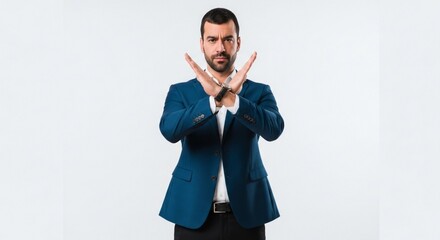 Businessman Showing Stop Gesture with Crossed Arms.