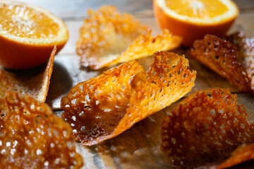 French tuile cookies. Classic butter and orange oval-shaped tuile cookies, a French recipe.