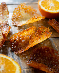 French tuile cookies. Classic butter and orange oval-shaped tuile cookies, a French recipe.