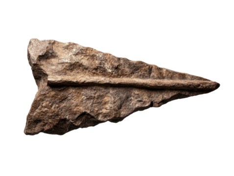 Ancient stone arrowhead artifact on black background