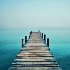 Naklejka premium Misty turquoise lake with pier, ideal for travel visuals, lifestyle blogs, wellness inspiration