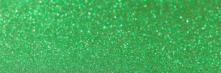 Green glitter bokeh circle glow blurred and blur abstract. Glittering shimmer bright luxury