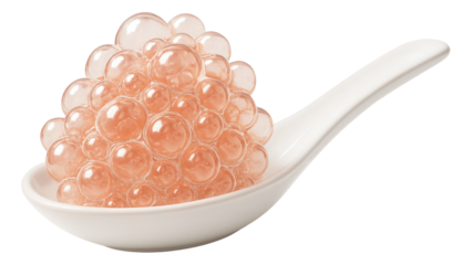A cluster of pink champagne bubbles resting on a minimalist ceramic spoon.