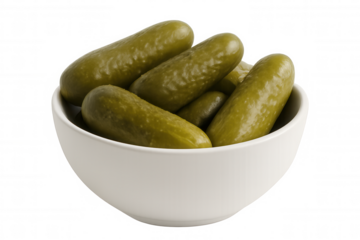 Gherkin pickles spilling from white ceramic bowl, showcasing crisp texture against transparent backdrop with culinary potential