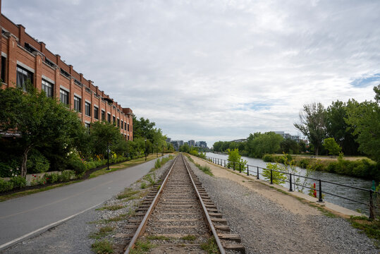 Bicycle and pedestrian path that runs along the canal, as well as a parallel railway line along the Lachine Canal in Montreal.