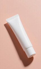 Top view of a blank white cosmetic tube on a pastel background, a minimalist mockup for branding skincare, beauty, or self-care products.