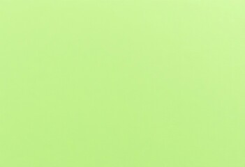 Close-up texture of subtly tinted light green cardboard sheet, solid, dull