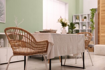 Stylish table with chair and decor in dining room. Interior design