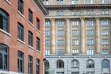 Close-up view of the architecture of two buildings located in Old Montreal 