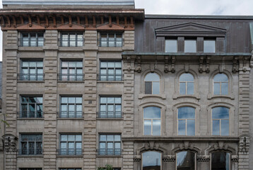 Fototapeta premium Facade of two stone buildings located in Old Montreal 