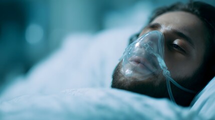 Patient in hospital bed wearing oxygen mask
