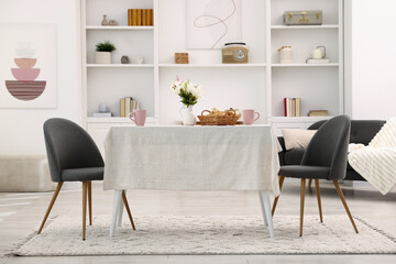 Stylish table with chairs and decor in dining room. Interior design