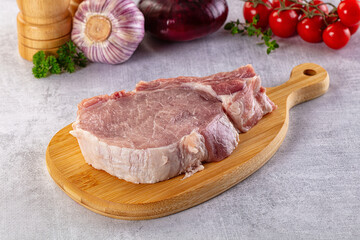 Raw pork steak with bone