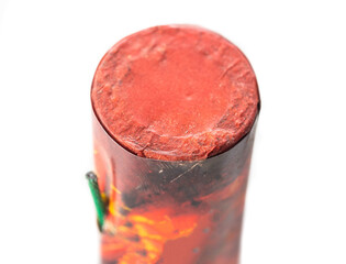 Flying firecracker fireworks with a wick on a white background, close-up, safety precautions