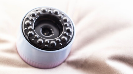 Modern vacuum anti-cellulite massager, close-up. Tightening of loose skin and cellulite, portable. Copy space for text