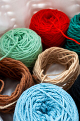 Colorful yarn balls in basket for knitting and crochet projects