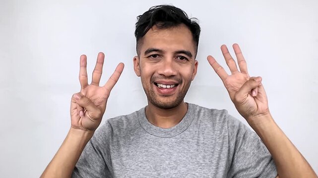 Man Shows Three Fingers, Counting.