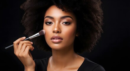 Obraz premium Woman Applying Makeup with Brush, Isolated on Black Background