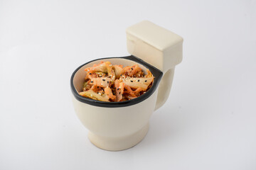 Korean spicy kimchi salad in a toilet bowl

