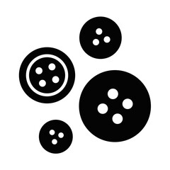 Four black sewing buttons in a scattered arrangement silhouette