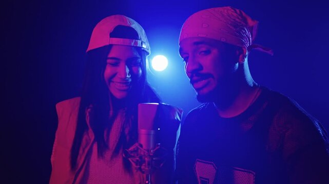 Duet of young rappers singing with passion in slow motion