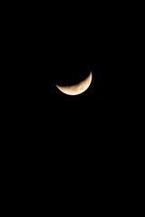 crescent moon shines at night © MEI NAPIKUL