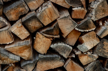 Fototapeta premium Stacked Firewood Creating a Rustic Background for Illustrative or Environmental Use