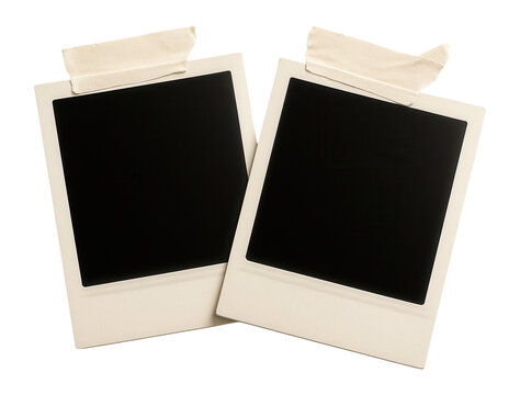 Two polaroid photo frames with tape strips.