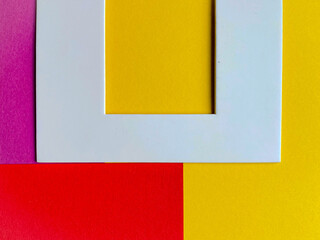 yellow and red paper with white border 