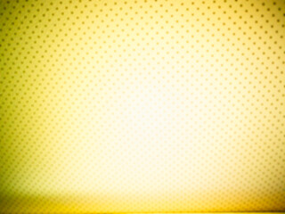 Yellow perforated abstract surface texture backdrop