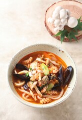 Close-up of spicy Korean seafood soup with beech mushrooms, mussels, shrimp, squid, and vegetables prepared by master chef Hanshunseop. Photographed in Korea.