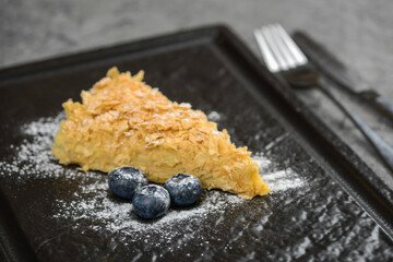 dessert cake filled in a black plate