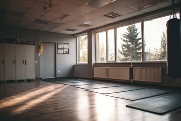 Fototapeta premium Sunlit interior of a spacious exercise room.