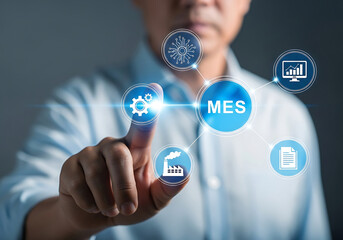 Business professional pointing to a manufacturing execution system and related concept icons