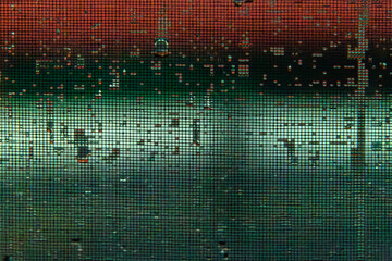 wet insect screen with rain drops at the window in the night