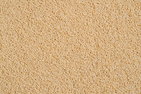 Close-up texture of dry active yeast granules baking