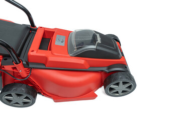 Fototapeta premium Lawn mower battery compartment. Close-up of the battery compartment on a red cordless lawn mower isolated on a white background. Visible compartment with transparent cover.