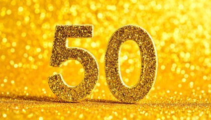 Number 50 made of golden glitter, sparkling festive vibe. Celebration symbol.
