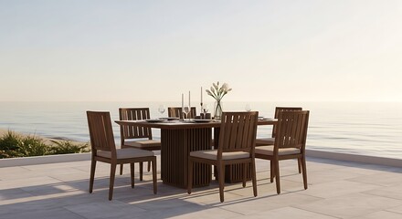 Fototapeta premium Outdoor dining set with chairs on a patio overlooking the ocean at sunset