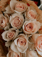 Close-up of a bouquet of pale pink roses with delicate petals.