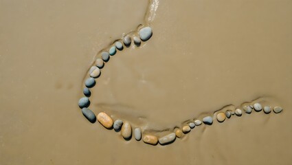 A delicate necklace crafted from smooth colorful beach pebbles strung on a thin cord