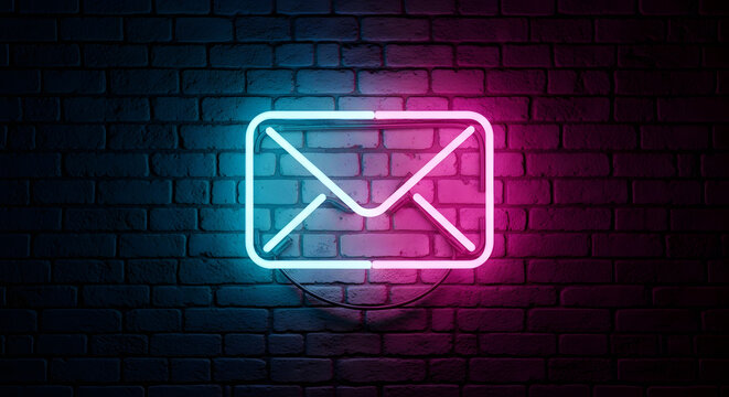 Neon email icon glowing on a dark brick wall, representing digital communication