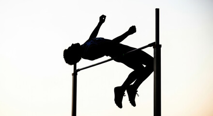 Athlete's leap in silhouette demonstrates athletic prowess and competitive spirit, embodying