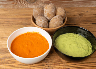Red mojo rojo and green mojo verde sauces, traditional Tenerife dips, mojo picon dressing