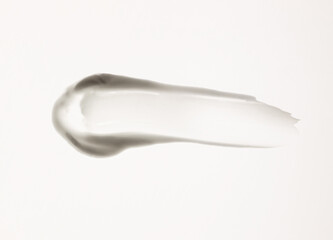 white cream smear, cosmetics textures on the white background