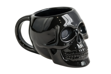 A glossy black skull shaped mug on black background