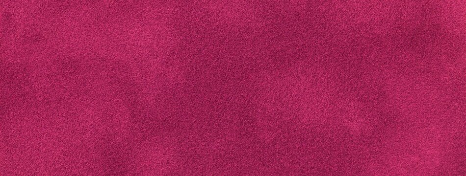 Dark purple background of suede fabric, macro. Velvet texture of wine textile. Felt soft magenta backdrop surface
