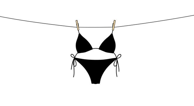 Minimalist black bikini hanging on clothesline with clothespins