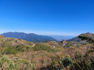 Beautiful panoramic view of one of the trails in Itatiaia National Park, Brazil. High-altitude vegetation and mountains in the background